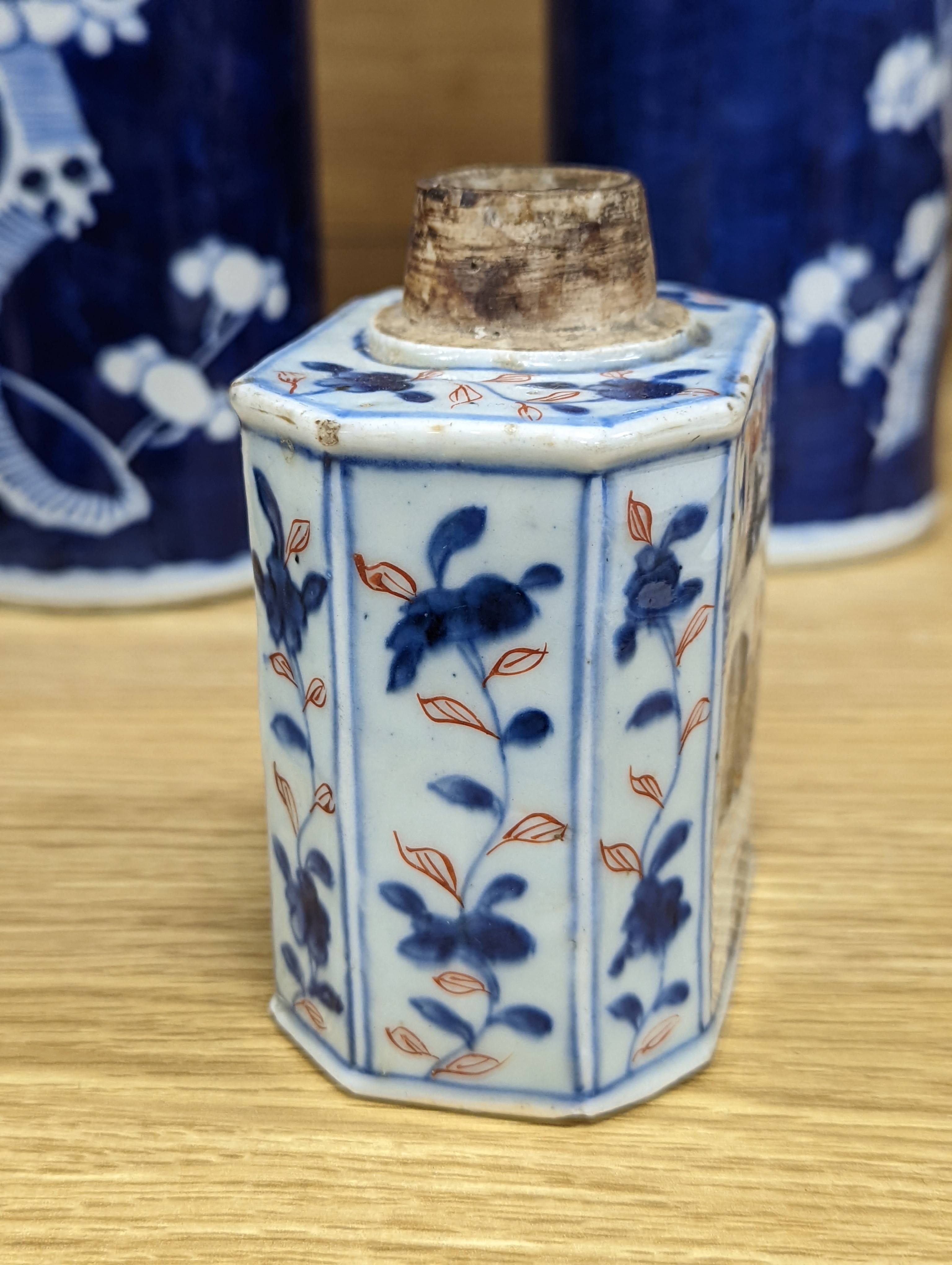 An 18th century Chinese famille rose mug, a Chinese Imari tea caddy and two Chinese blue and white sleeve vases 30cm (4)